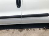 a picture of a white car with black trims