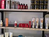a shelf with many different types of skin care products