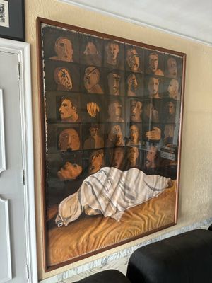 a painting on the wall above a couch in a living room