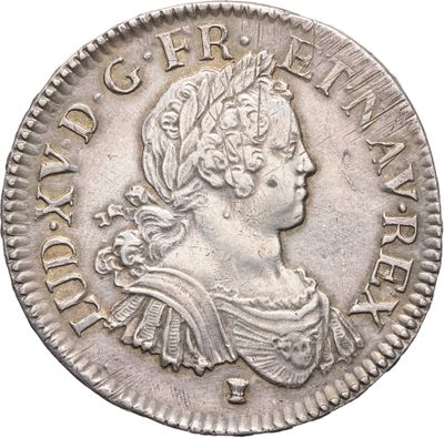 une pièce d'argent portant une tête de femme et une couronne