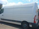 a white van that is parked on the side of the road