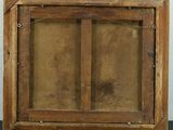 an old wooden frame with a glass window on a black table