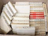 a box full of old books sitting on a table