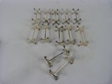 a lot of different metal objects on a white surface