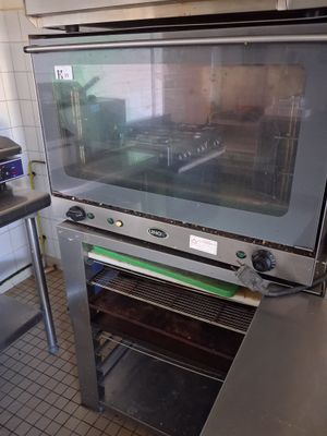 a large oven that is sitting in the middle of a kitchen