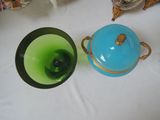 two vases that are sitting on a table