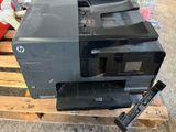 a printer sitting on top of a pallet on a pallet