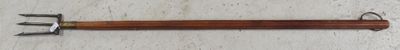 a picture of an old fashioned toothbrush on a wooden table