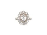 a close up of a diamond ring on a white background