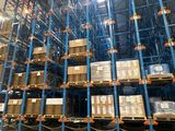a large warehouse filled with lots of boxes and pallets
