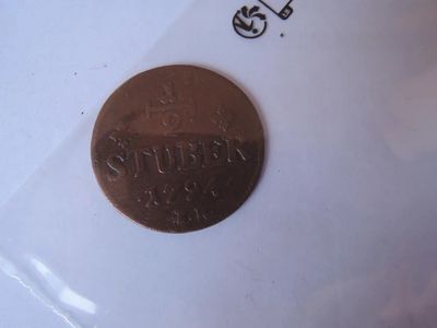 une petite pièce posée sur un bout de papier
