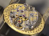 a close up of a watch that is being worked on