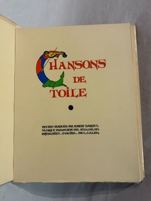 un livre ouvert dont la couverture représente un clown