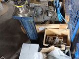 a machine that is sitting on a pallet in a garage
