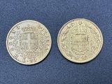 two silver coins, one of which has a coat of arms and the other of which is a shield