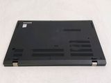 a black laptop that is sitting on a white surface