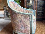 a chair that is sitting in the middle of a room