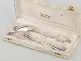 a silverware set in a box on a table