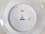 a white plate with a blue and white design on it