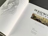 an open book with a drawing of a woman on it