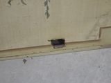 a small hole in the floor of a bathroom