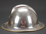a silver helmet with a gold band around the brim