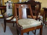 a chair and a table in a room with yellow walls