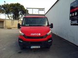 a red van that is parked in a parking lot