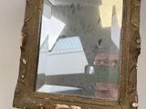 a man taking a picture of himself in a mirror