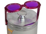 a canister with a pair of sunglasses on top of it