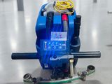 a machine that is sitting on the floor with a hose
