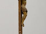 a statue of a man on a cross on a table