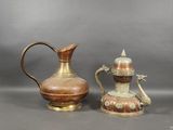 pair of antique brass and copper jugs and a candle holder