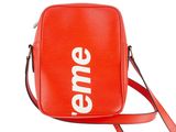 an orange bag with a white supreme logo on it