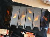 a black case with gold fish painted on it