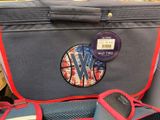 a suitcase that has a sticker on the side of it