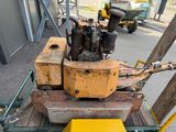a machine that is sitting on a cart in the street