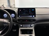 the interior of a car with a steering wheel, dashboard, and display screen