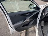 a car door open with the driver ' s side door open