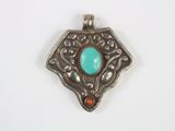 an image of a silver pendant with a turquoise stone in the center