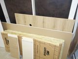 a lot of cardboards stacked on top of each other in a room