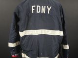 a fireman ' s jacket with the word fdny on it