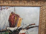 an oil painting of a sailboat in a gold frame on a wall