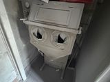 a toilet that has two eyes on it in the bathroom