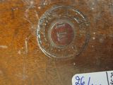 a close up of a piece of wood with a sticker on it