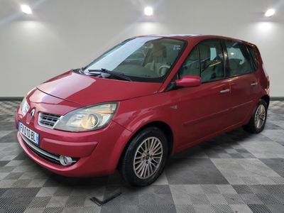 a picture of a red car parked in a garage