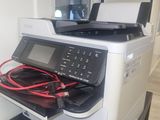 a printer that is sitting on top of a desk