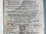 an old book with writing on it sitting on top of a table
