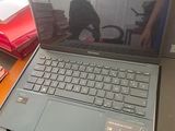 a laptop computer sitting on top of a desk