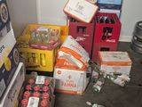 many boxes of beer sitting on the floor next to each other